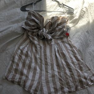 Cute tan/white romper from Mystique Boutique!